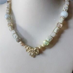 Genuine pearls, jade, vintage floral pink glass, and vintage broach